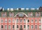 Facade of an old building with a mansard roof