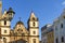 Facade of old and historic churches and houses in colonial and baroque style in the tourist center of Pelourinho