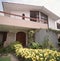 facade of a one-story private house with garden lima peru