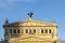 Facade of opera house â€žAlte Oper Frankfurtâ€œ old opera with inscription â€ždem wahren schÃ¶nen gutenâ€œ, translated in