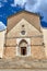 Facade and portal of a stone, medieval church