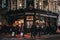 Facade of Red Lion pub in Shoreditch, London, UK, people in front, motion blur