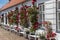 Facade with red roses at the courtyard of the castle in Glucksburg