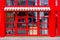 Facade of the restaurant with panoramic red wooden windows.