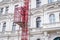 Facade restoration concept. Beautiful historic Prague house and scaffold elevator