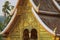 Facade and roof decoration of the Haw Pha Bang Buddhist temple at the Royal Palace Museum in Luang Prabang, Laos.