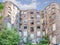 Facade of ruined old vintage red brick house with broken windows location: Kamienico, part of former Jewish ghetto, Walicow