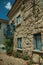 Facade of a rustic house with decorated balcony