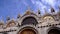 Facade of Saint Mark Basilica decorated with golden frescos