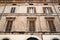 facade of shabby medieval house in Brescia city