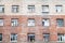 facade of shabby wall of multistorey brick house