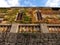 Facade of a stone manor house in the town of Valldemossa, Majorca, Spain, facade overgrown with ivy and looking like a face