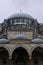 Facade of Suleymaniye Mosque with intricate lettering above the entrance. Istanbul, Turkey.