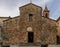 The facade of thr ancient church of Santa Maria Assunta in Fabbrica di Peccioli, Pisa, Italy