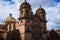 Facade with the towers of the entrance of a stone ancient church