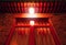 Facade of a traditional Chinese house hutong in the dark under the light of a red traditional oriental lantern