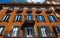 Facade of traditional colorful european italian apartment building in Rome , Italy.