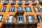 Facade of traditional colorful european italian apartment building in Rome , Italy.