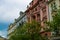 Facade of a typical colorful classic building in a street in middle of Prague, Czech Republic