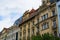 Facade of typical colorful classic buildings in a street in middle of Prague, Czech Republic