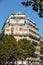 Facade of typical house with balcony in 16th arrondisement of Paris.