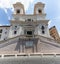 Facade view of The church of the Santissima TrinitÃ  dei Monti against blue sky above Spanish Steps, Rome, Italy