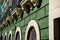 Facade wall on green plastered background in San Juan, Puerto Rico