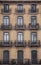 Facade with windows and balconies, historic building. Barcelona city. Spain