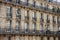 Facade, Windows and balconies of the houses in the centre of Paris,