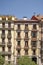 Facades of characteristic houses in the center of Madrid on a sunny spring day