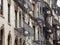 Facades of historic buildings in the Soho district of New York. The characteristic iron safety stairs on the facades