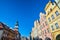 Facades of historic houses and tower of the town hall on the Market Square