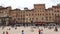 Facades of the historic medieval buildings in Piazza del Campo in Sienna.