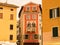 Facades of houses with wooden shutters of the old city. Tourist attraction.