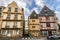 Facades of old buildings in Vannes old town viewed from the Quay of La Marle river.  French Brittany