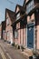 Facades of pastel pink cottages in Lavenham, Suffolk, UK