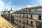 Facades and roofs of vintage urban residential apartment buildings