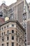 Facades of stone buildings and water deposits on rooftops. New York, USA