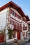 Facades of typical Basque houses in the touristic village of Ainhoa, France