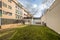 Facades of urban residential buildings with landscaped common areas and a pool covered with a canvas to spend the winter