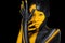 Face art. Woman with black and yellow body paint. Young african girl with colorful bodypaint. An amazing model with
