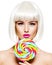 Face of a beautiful  girl with bob hairstyle  and multicolor sweet candy