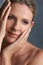 Face, beauty and thinking with mature woman in studio on gray background for aesthetic wellness. Skincare, relax and