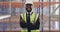 Face, black man or engineer as happy in factory in experience in safety gear with logistics. African person, supply
