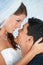 Face, bride and groom embrace at wedding with smile, love and commitment for couple at reception. Romance, man and woman