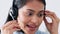 Face of call center worker talking to people online, giving advice and doing telemarketing with headset in work office