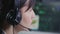 Face close up of female stock trader looks at computer screen