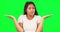 Face, confused woman and shrug on green screen, hands and forgot questions of choice, emoji and reaction. Portrait