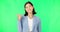 Face, employee and woman pointing, green screen and happiness against a studio background. Portrait, female entrepreneur