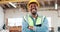 Face, engineer and happy black man with arms crossed in woodwork workshop. Portrait, smile and confidence of